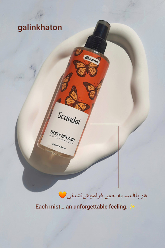 نمای نزدیک اسپری بدن بلوما با رایحه اسکندل روی سنگ سفید_بادی اسپلش زنانه اورجینال با رایحه ماندگار اسکندل ، خرید اینترنتی بادی اسپلش بلوما اصل باکیفیت بالا از میکسین